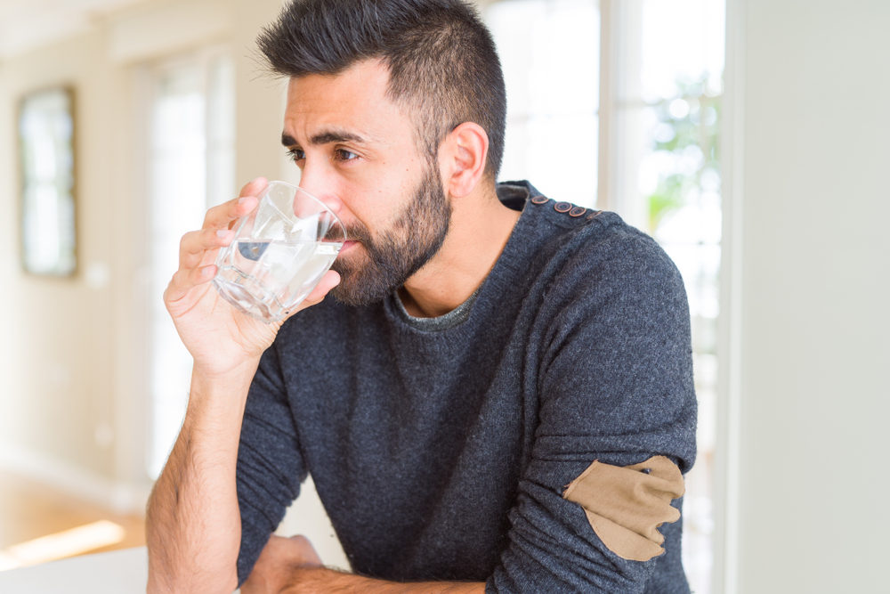 Handsome,Man,Drinking,A,Fresh,Glass,Of,Water