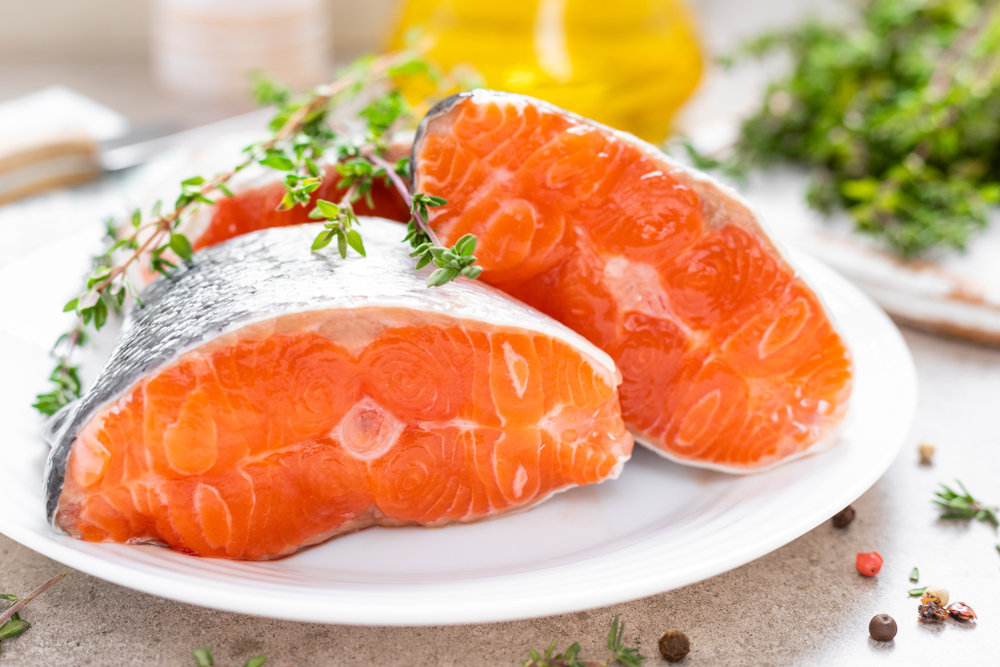 Fresh,Raw,Salmon,Fish,Steaks,On,White,Kitchen,Background